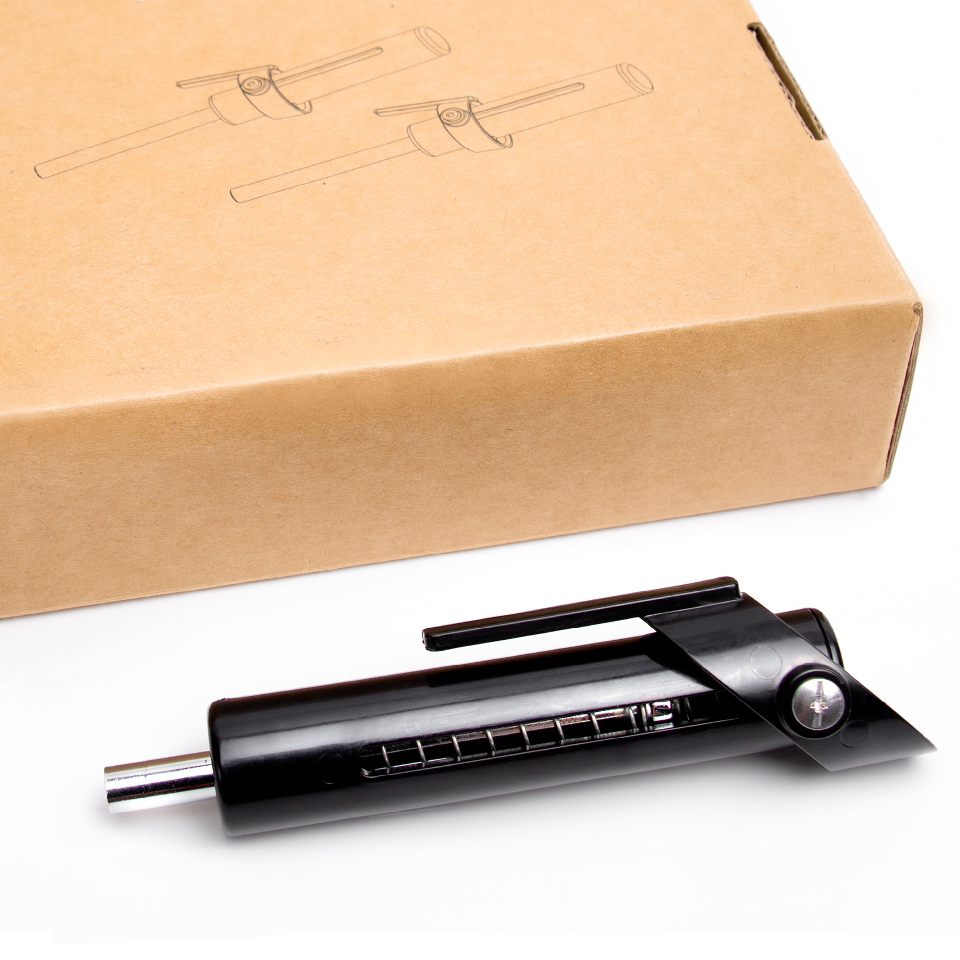 Dropset pin posé à côté de sa boîte – accessoire durable et simple à utiliser en musculation.